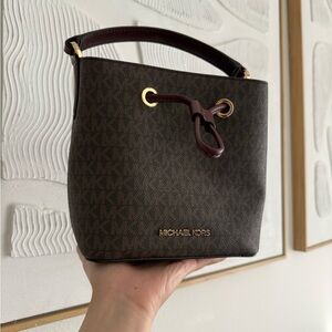Michael Kors Brown Monogram Bucket Bag with Burgundy Accents